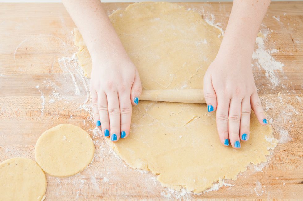On a floured surface, roll out dough to about 1/2 inch thickness. We rolled ours out a little thinner that so make sure to roll out to your preferred donut thickness!
