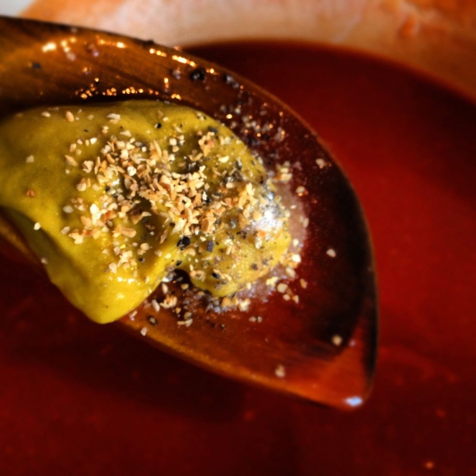 On a large wooden spoon add the mustard, 5 spice, salt and pepper, and mix into the sauce.