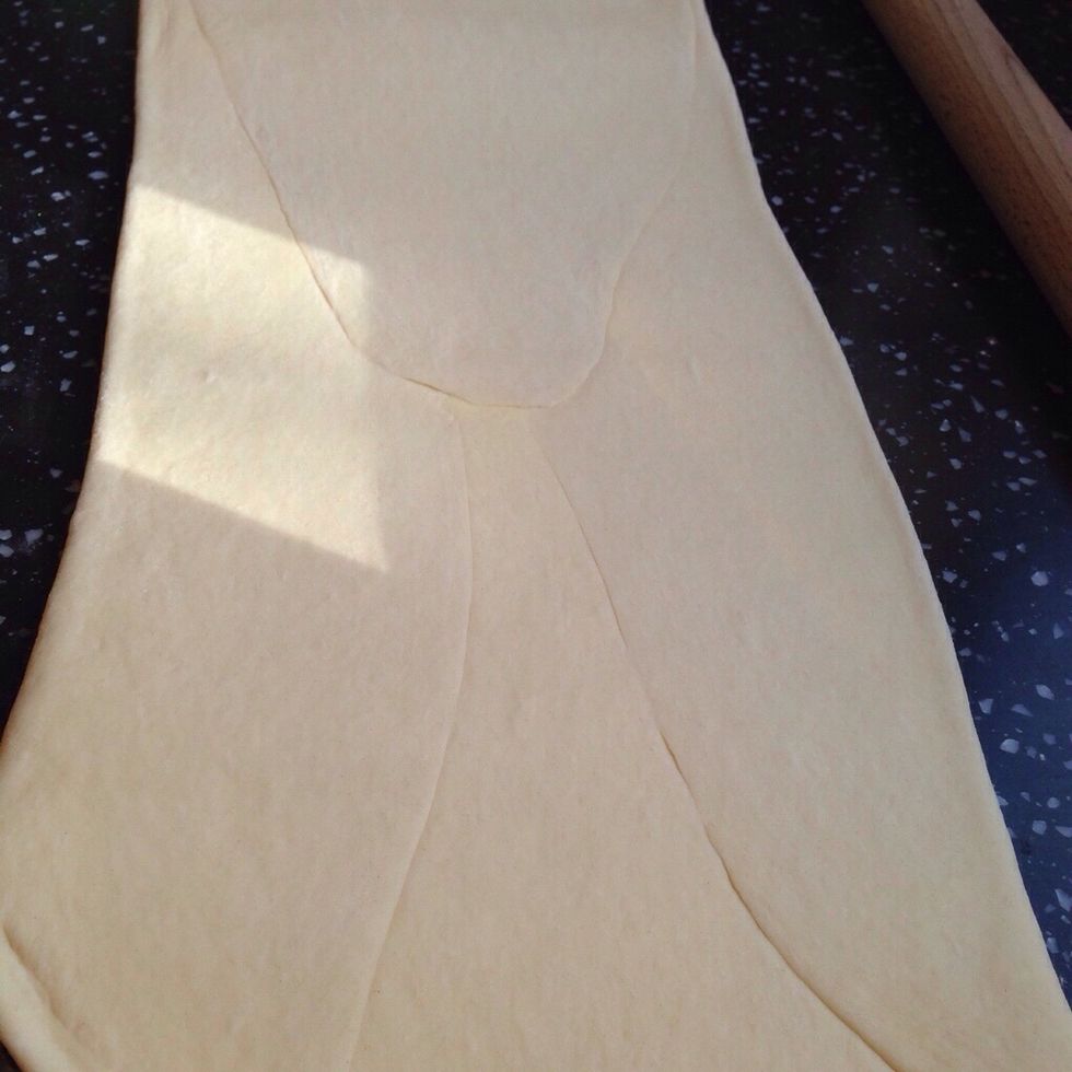 On a lightly floured surface roll out the dough and sealed butter until you have a rectangle 20x60cm. Start rolling from the centre towards the edges. Concentrate on lengthening rather than widening