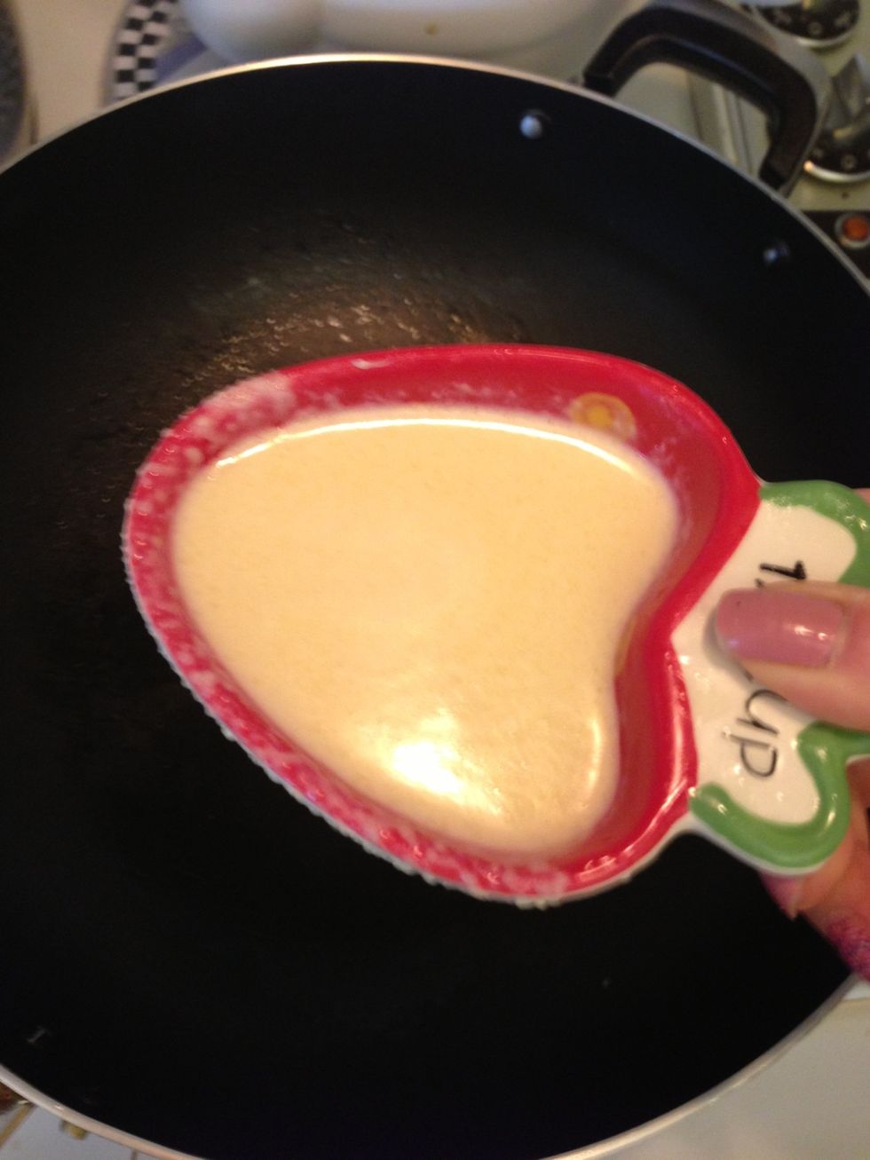 On a lightly oiled frying pan on medium high heat, pour approximately 1/4 cup of batter