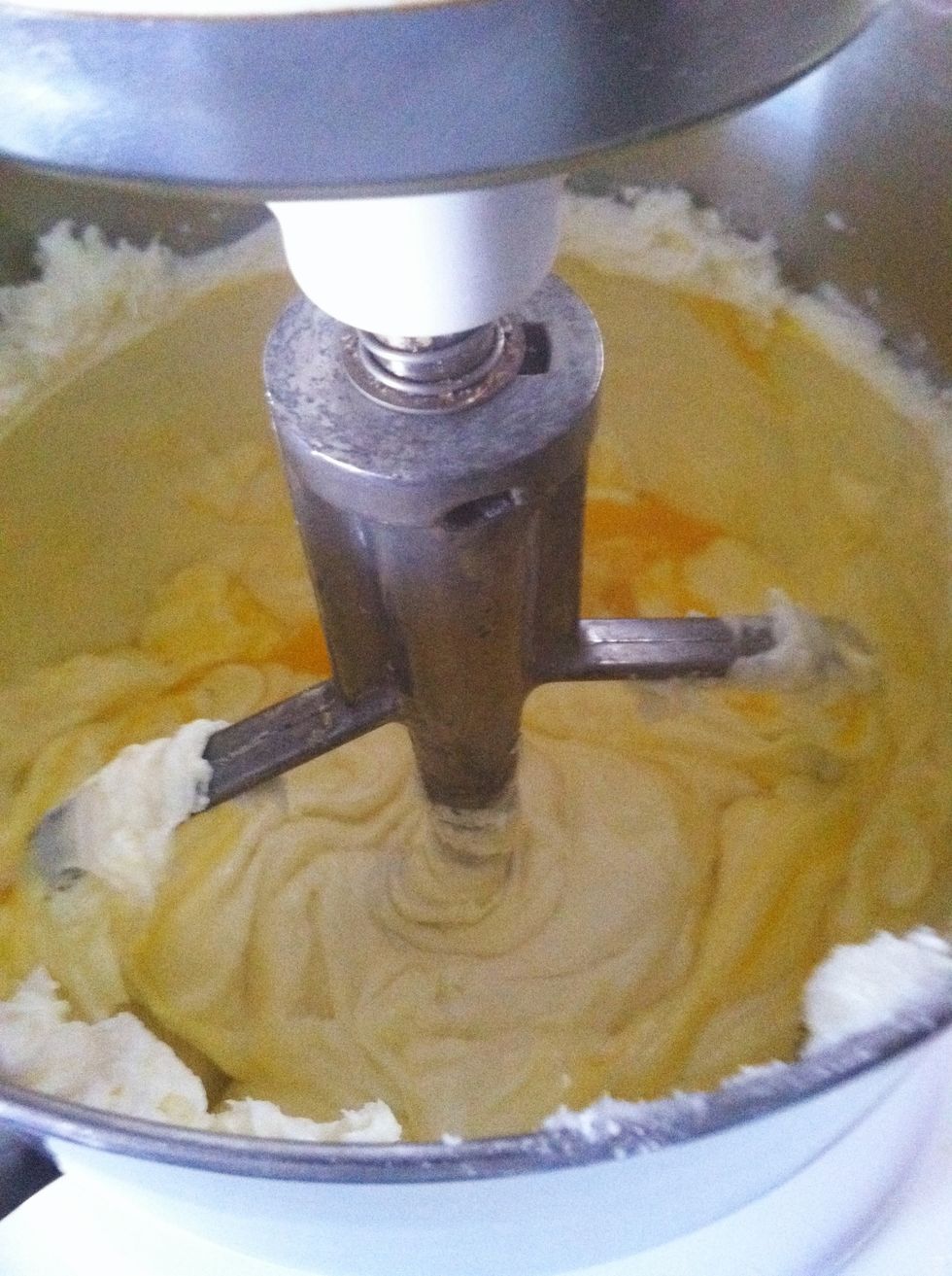 On a low speed, mix the cheese, eggs, and sugar until well blended.