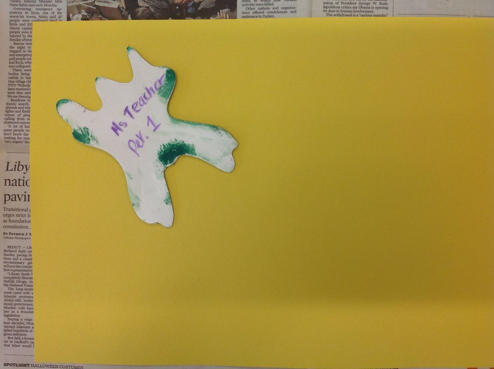 On a separate newspaper, place your bug face-down on your large sheet of paper.
