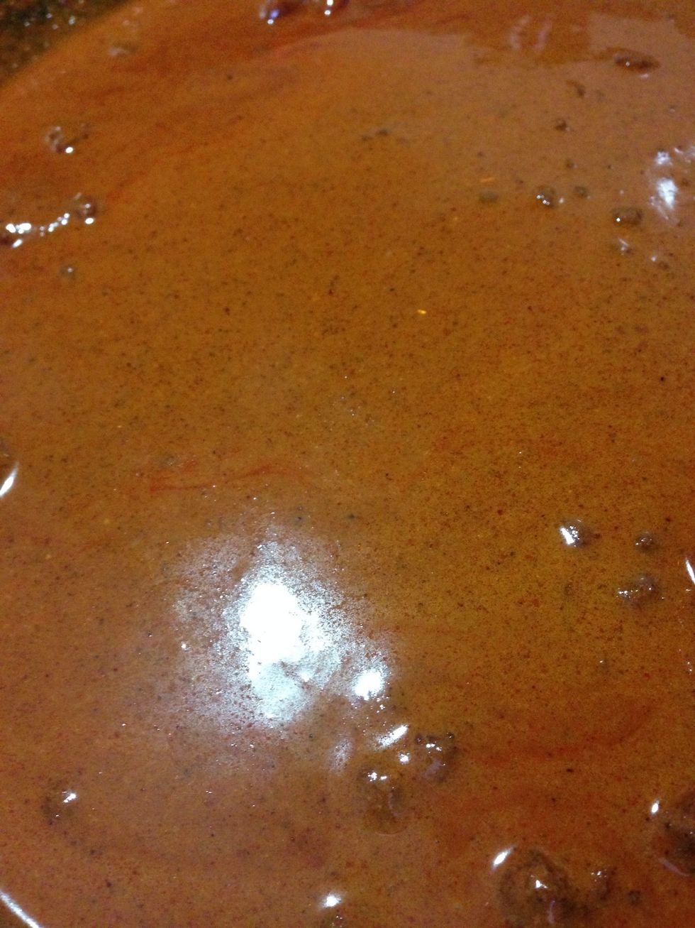 On an other hot pan start cooking the adobo ( onion, dry chilies, garlic and tomatoes, boiled, blended and reduced ) that's the adobo