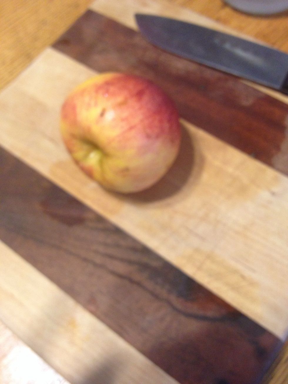 On cutting board, position apple on its side and slice very thin. Thinner the better. (If it's too thick it looses the "chip" consistency.
