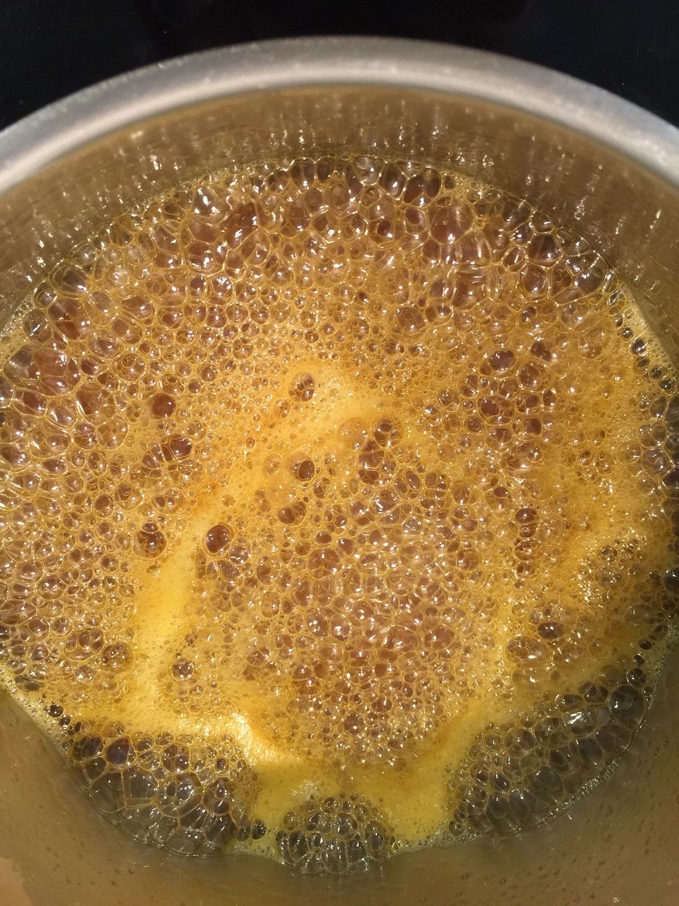 On low heat boil the & Reduce the orange juice-sugar to 1/2 (to make 1 cup) and the sugar turn into caramel.
