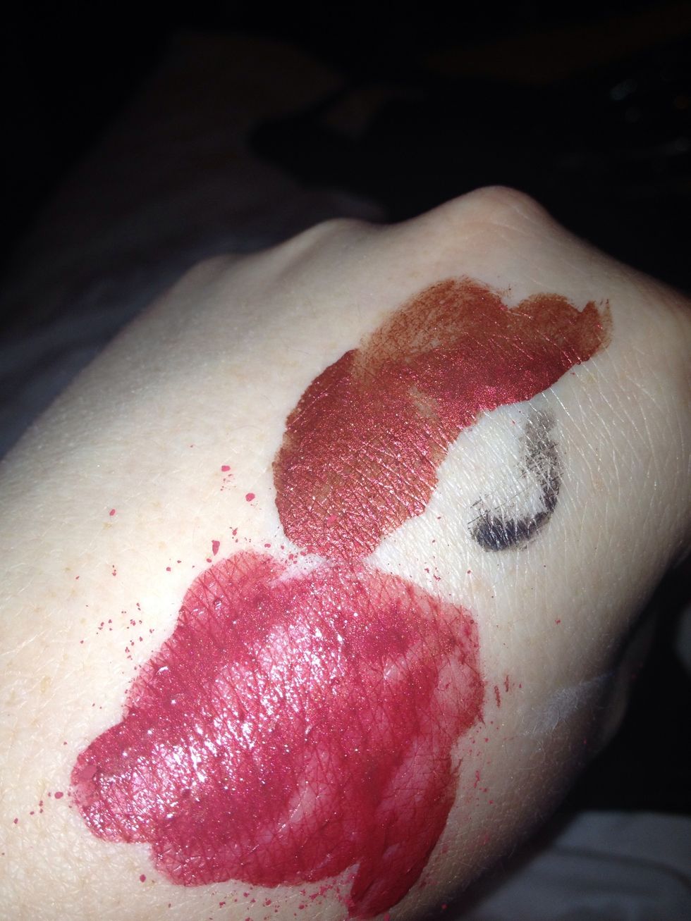 On my hand I've taken red shadow and pigment again both Illamasqua with mixing medium it makes pigments stronger