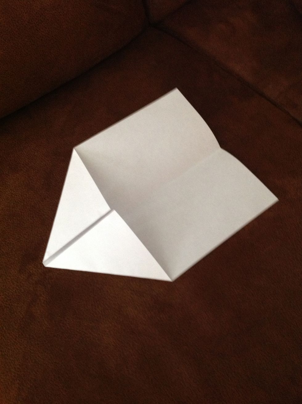 On one end of the paper, fold each corner in towards the center to the point where the inside edges are even with the centerline crease.