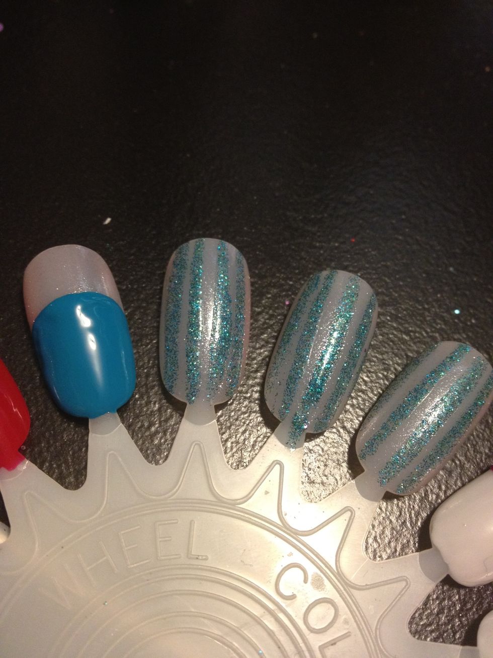 On one finger draw a blue circle 3/4 up the nail