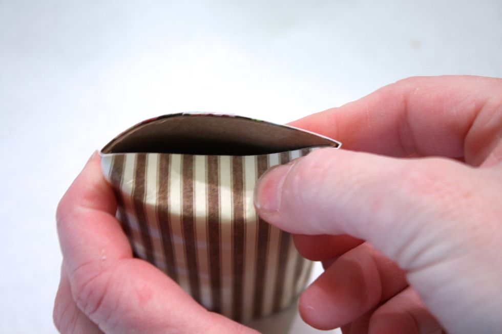 On one side do a slight fold in- this is just to use as a guide to cut the slot out