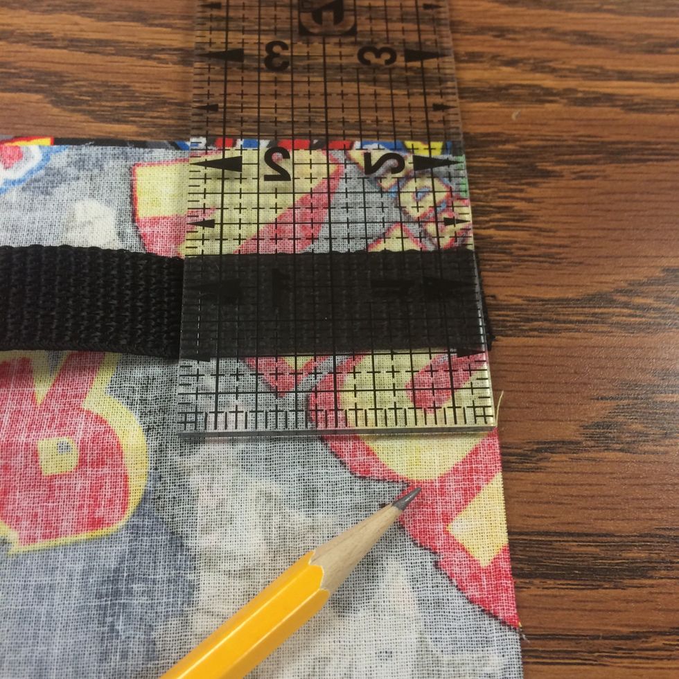 On one side edge from the top, measure down 2" and mark with a pencil