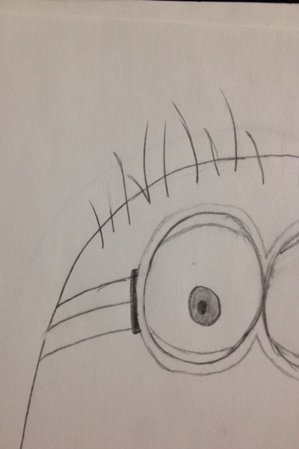 On one side of his head do about 10 strokes that are curling to the left, long and short