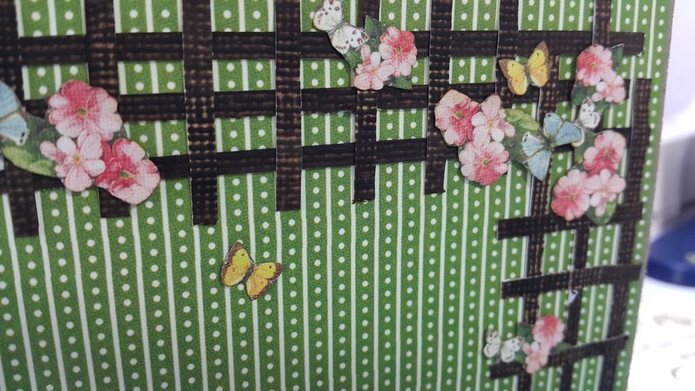 On one side of the playhouse, use cardstock scraps and color them to make the trellis, with those fussy cut flower and butterfly to decorate.