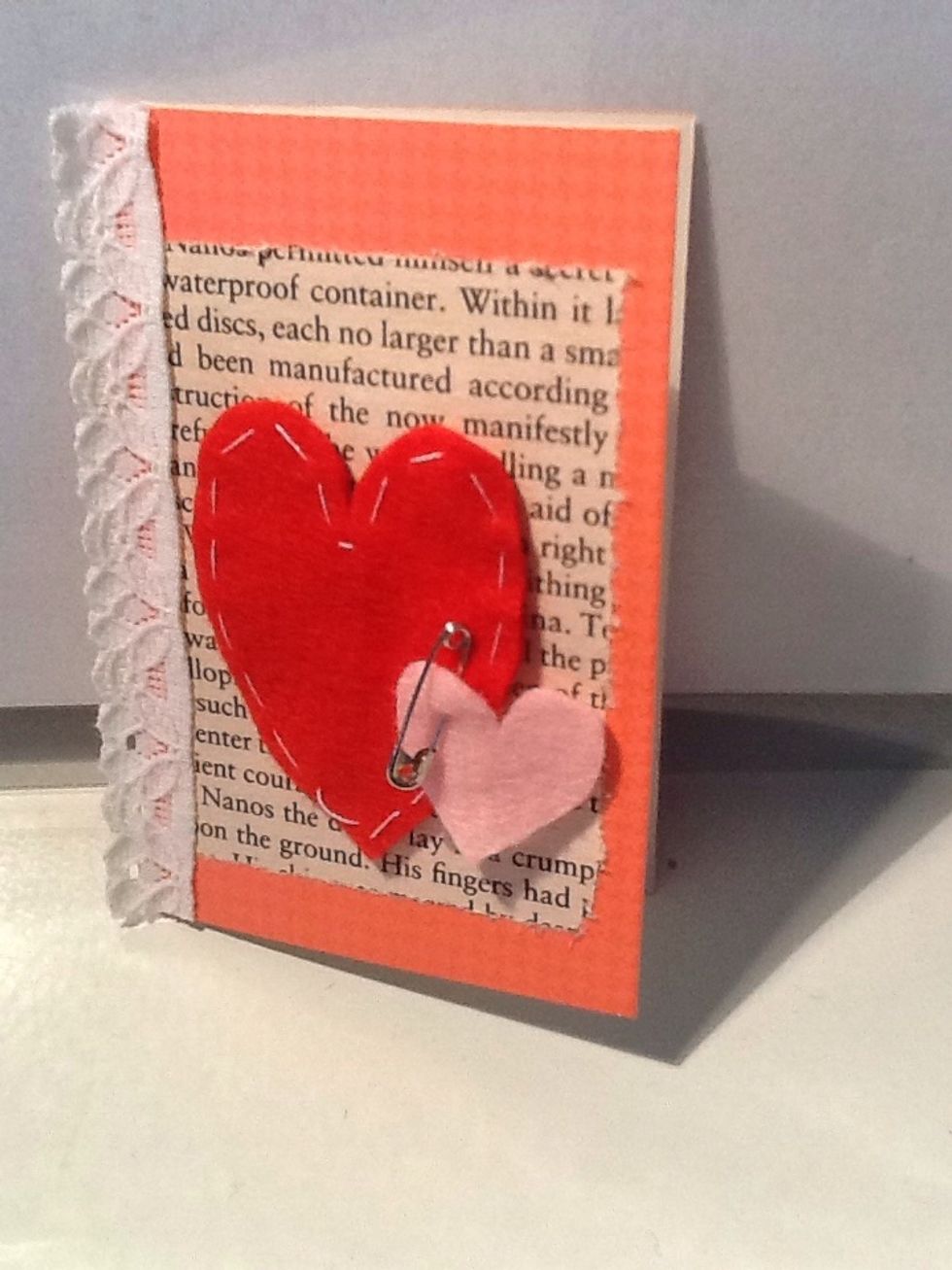 On pink felt, cut out a smaller heart, and using a tiny pin, secure it onto the red heart. No glueing required! How cute is that?