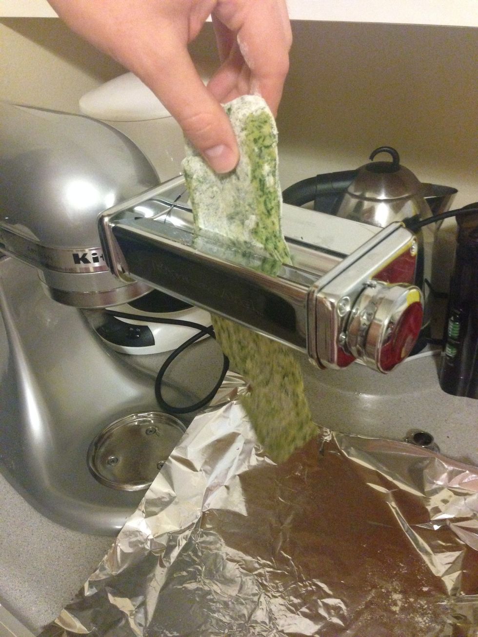 On setting 2, speed 2, feed your pasta through. It's ok if it breaks a bit. Fold the pasta over and feed it through again. Make sure the dough has a small amount of flour to go through the roller.