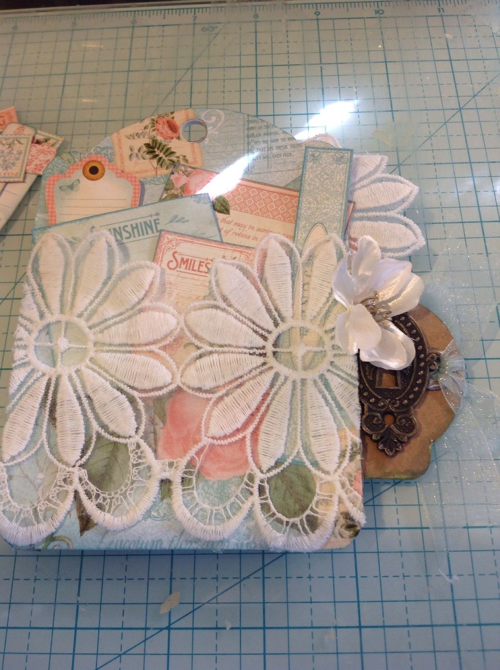 On the back of each tag I created pockets. For June I used lace to do so.