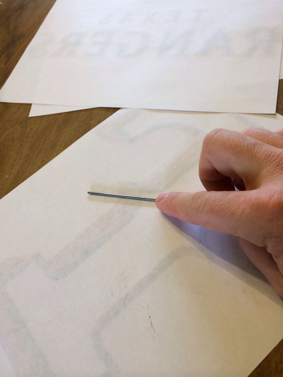 On the back of your designs rub the graphite all over it make sure it's dark, like real dark. Like "I'm getting this crap everywhere" Dark. Don't be scared. There are scarier things to be scared of.