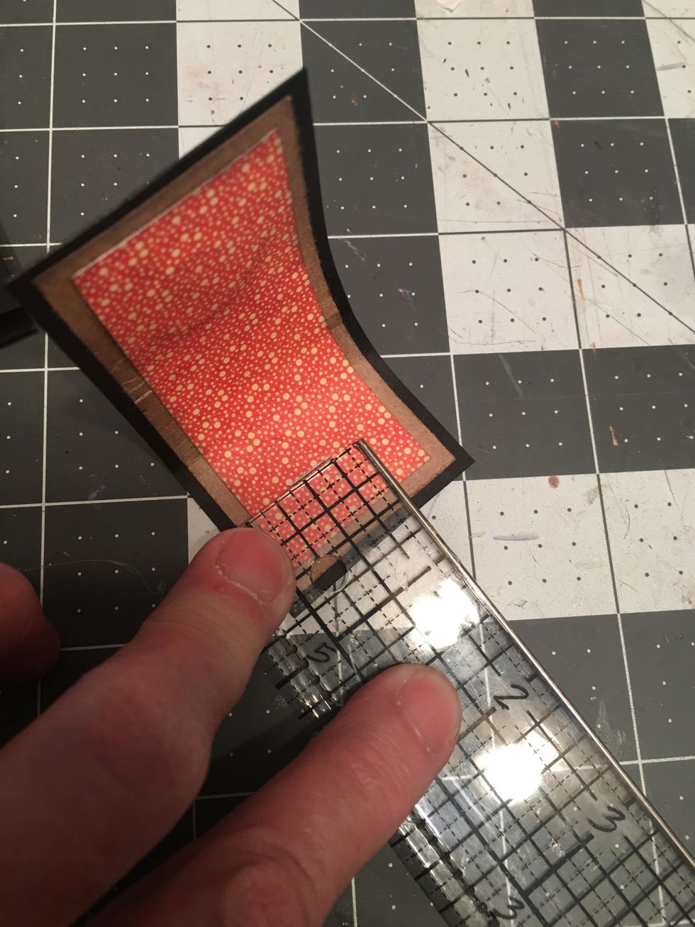 On the back side of your closure (the side with the magnet) place a mark in the center 5/8 - 3/4" from the end.