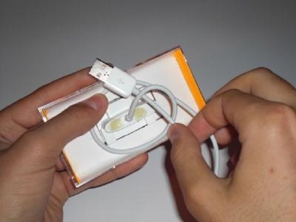 On the back side, tie a knot with the cable.