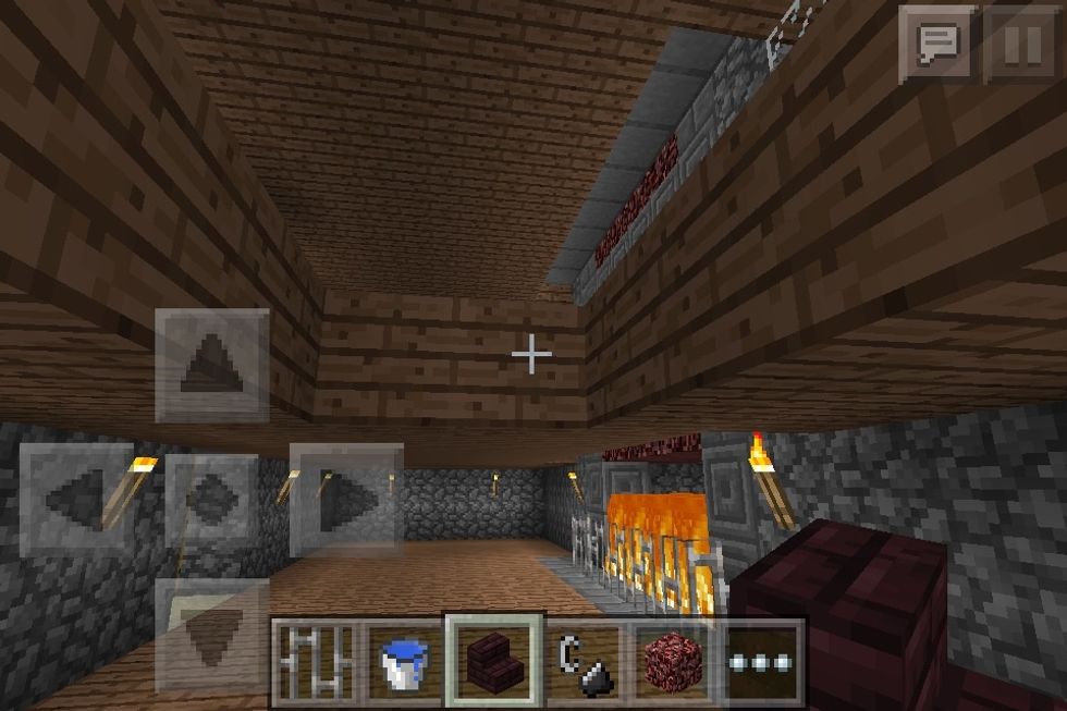 On the bottom floor break a two block wide, four block long gap from the wall.