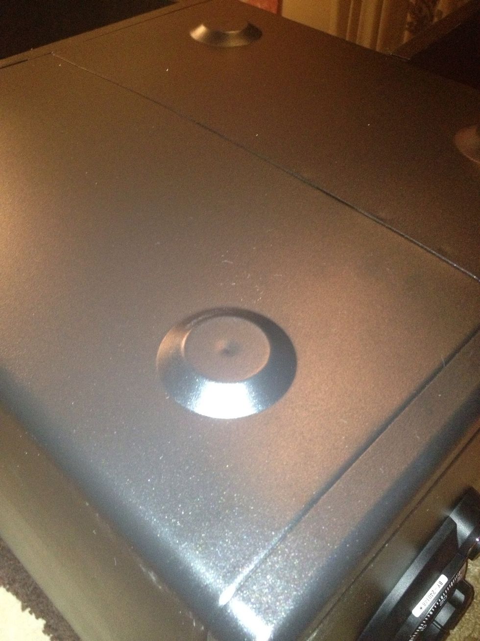 On the bottom of the safe, two of the legs had indents which I could drill through.