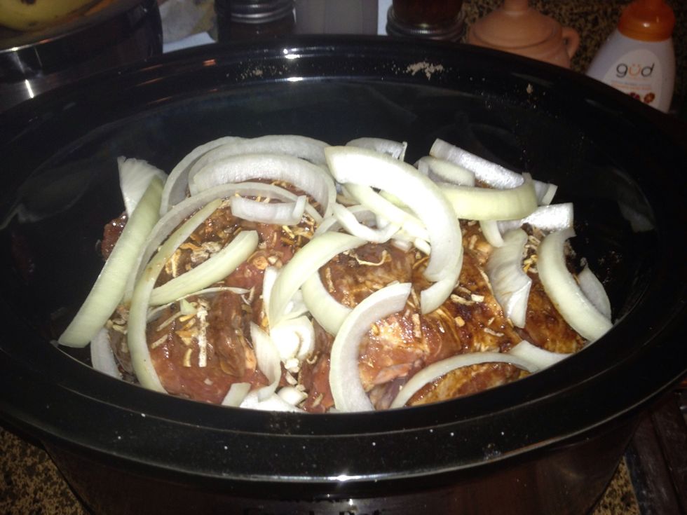 On the bottom of your crockpot add half a thick sliced onion & 2 chunked bell peppers; set pork roast on top. Top with 1 packet of onion soup mix, left over marinade & the other half of onion.