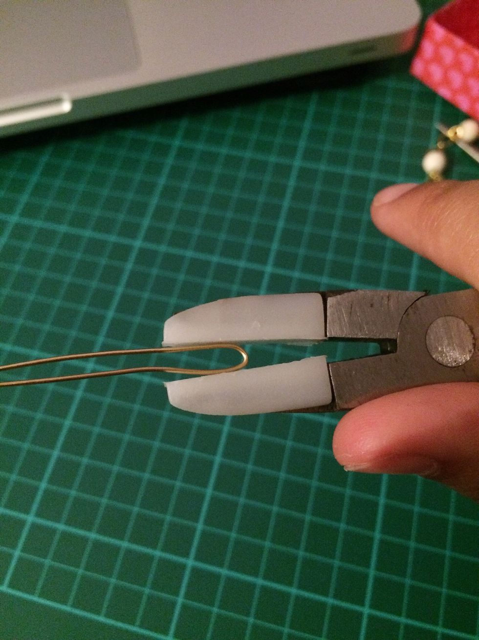 On the curved end, using the nylon pliers, gently push both sides together. This can be fiddly, but be patient and try to be as gentle as you can while trying to get them as close as you can.