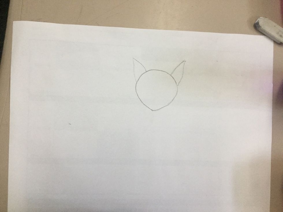 On the curved side at the top of the oval, draw a triangle. Make it so that the sides curve into a point. Do the same on the opposite side of the oval so that it looks symmetrical.