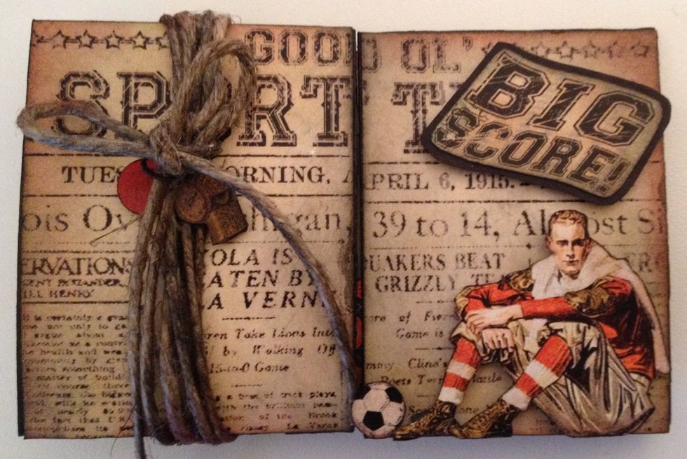 On the front Distressed twine and wrapped it around. Fussy cut out some images and popped up Big score that I first glued on black paper. Hope this is helpful and have fun creating :-)