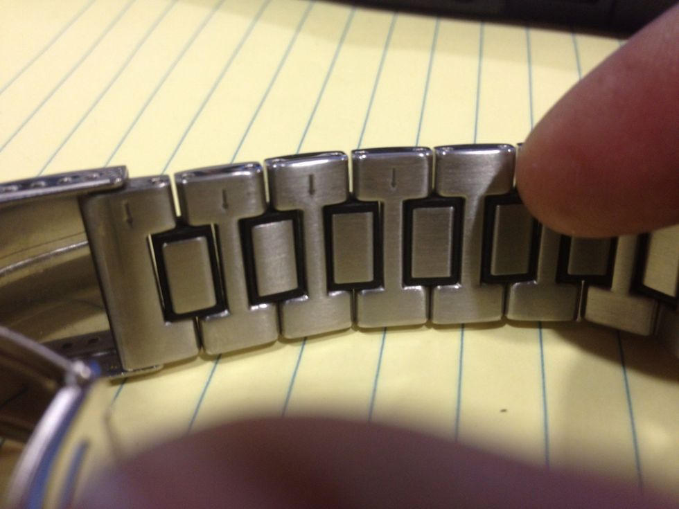On the inside of the band, it will tell you which direction the pins come out. If you don't see this, they may be screws, or a different kind of pin. Look in the band to determine what you have