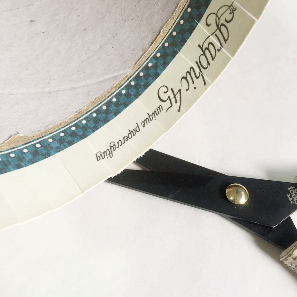 On the inside, snip around the flagging edge of the pattern paper.