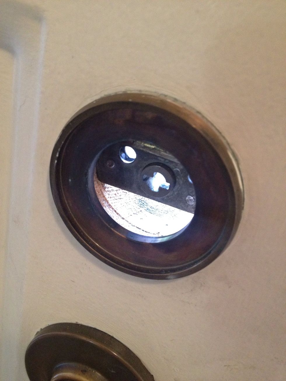 On the interior facing side of the door there is a surround for the piece that contains the bolts. Don't forget to put this on when remounting.