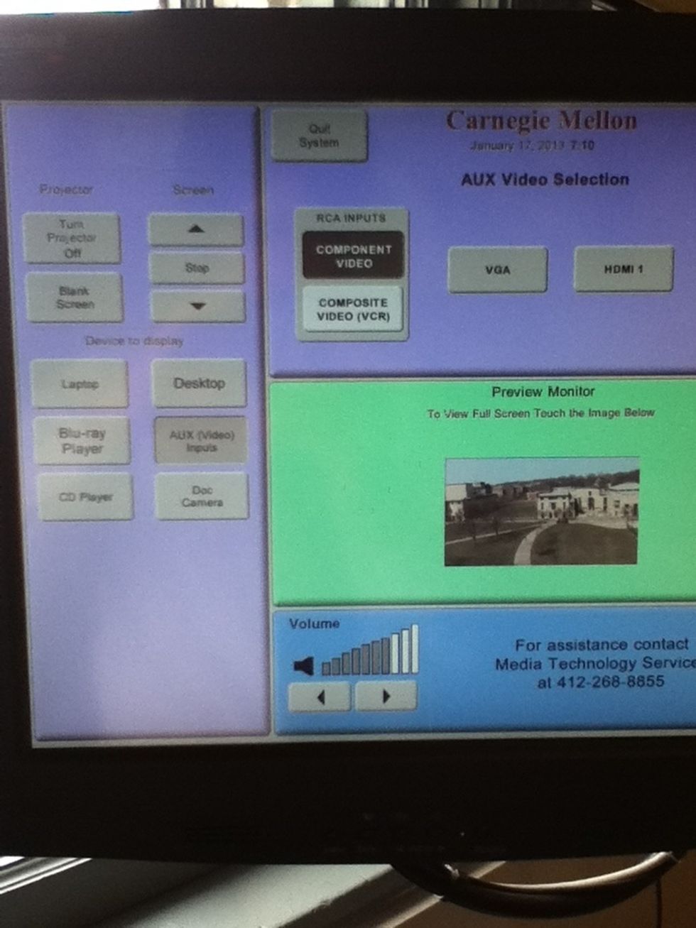 On the lectern, select AUX Video Inputs on the left side. Then select Component Video on the right. You can adjust the volume on the bottom.