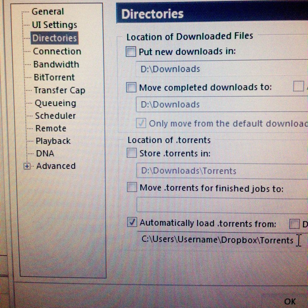 On the left side of the preferences window click on Directories, check the option named "Automatically load .torrents from:" and select a folder inside your Dropbox folder such as Torrents.