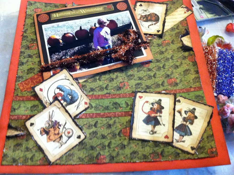 On the lower right side I put a corner of one of the playing cards over the photo mat to hide the tape. Then I affixed the other playing cards just as I originally planned.