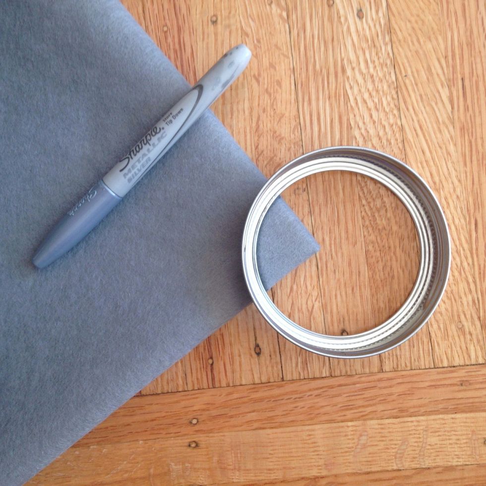 On the main folded corner create a tiny circle to cut out which will be around the trunk of the tree.