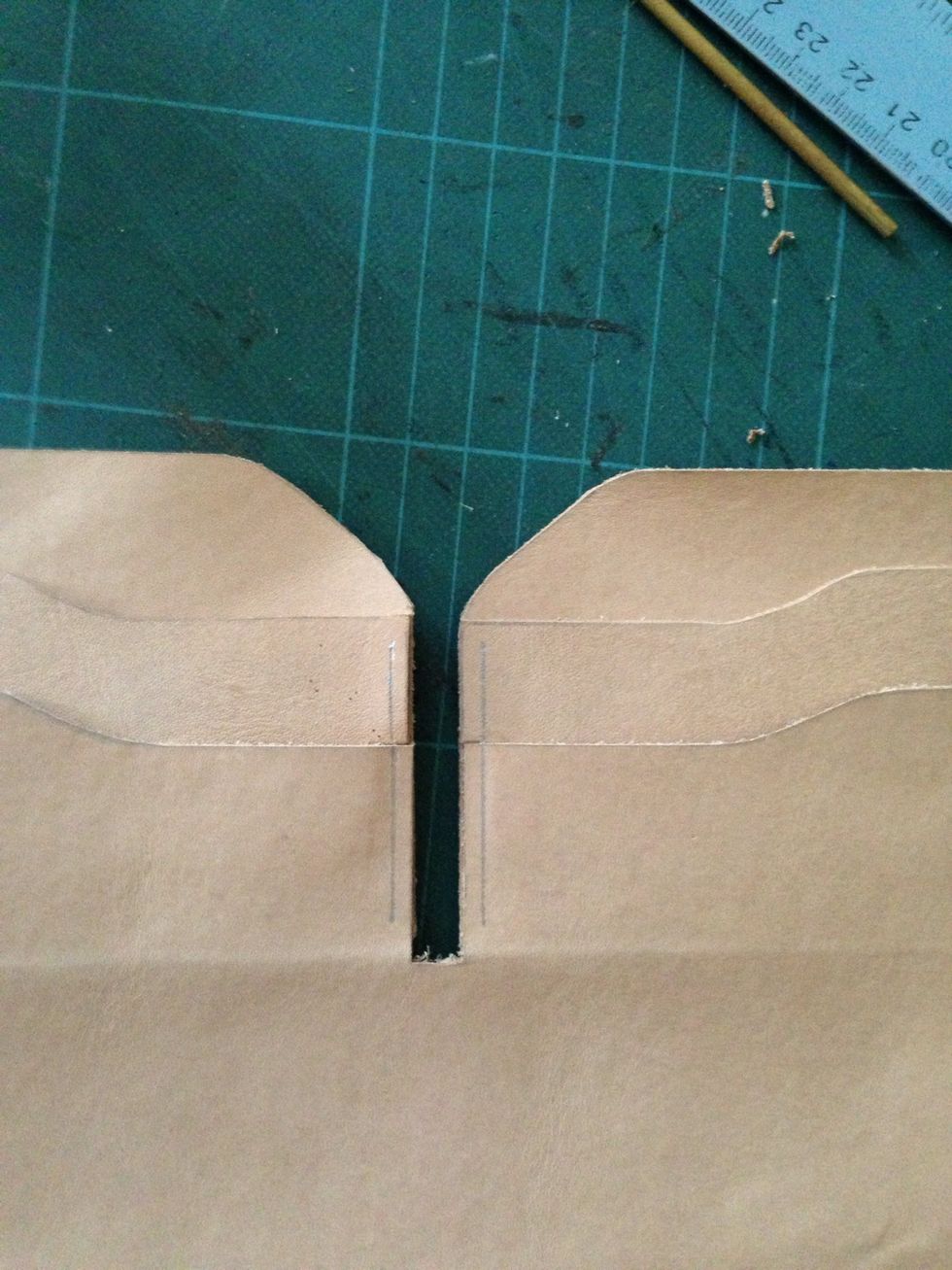 On the middle side, mark a line about 3mm from the edges (on both side) with your pen