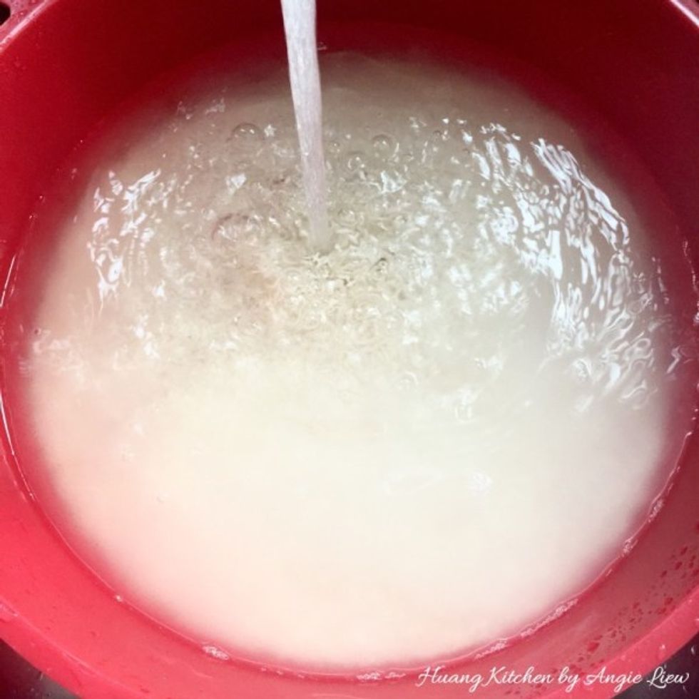 On the next day when you want to wrap the dumplings, wash the glutinous rice several times until the water runs clear. Leave to soak in water for 1 hour while you prepare to cook other ingredients.