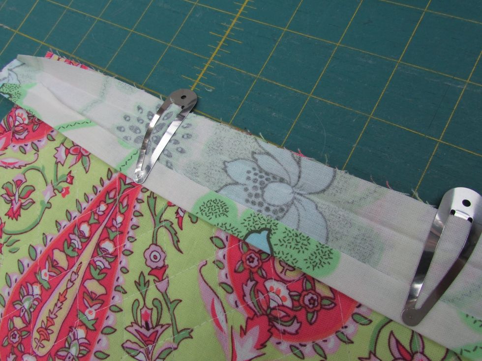 On the opposite end, open your trim piece and secure across the top.