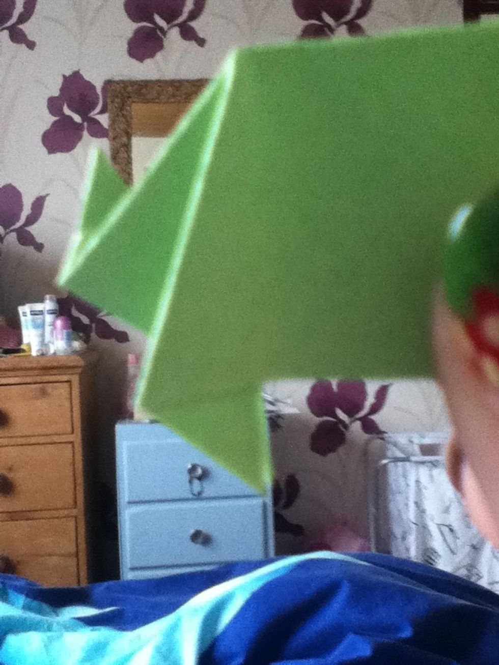 On the other end fold the corner upward. This will be the tail.