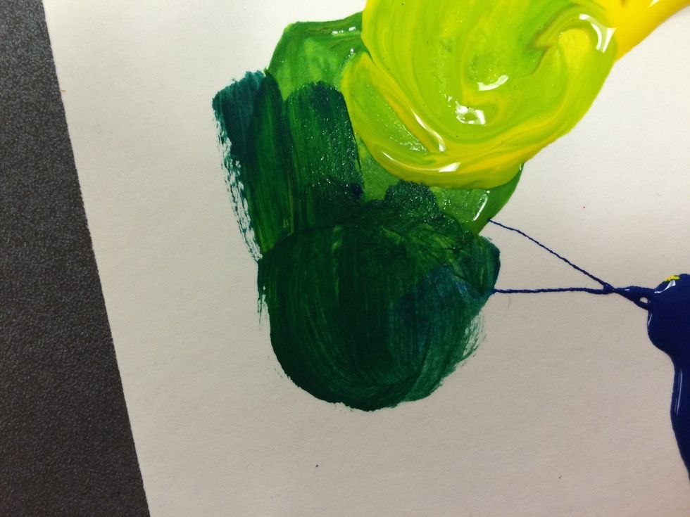 On the other half of the green add a small amount of blue. This should make BLUE-GREEN.