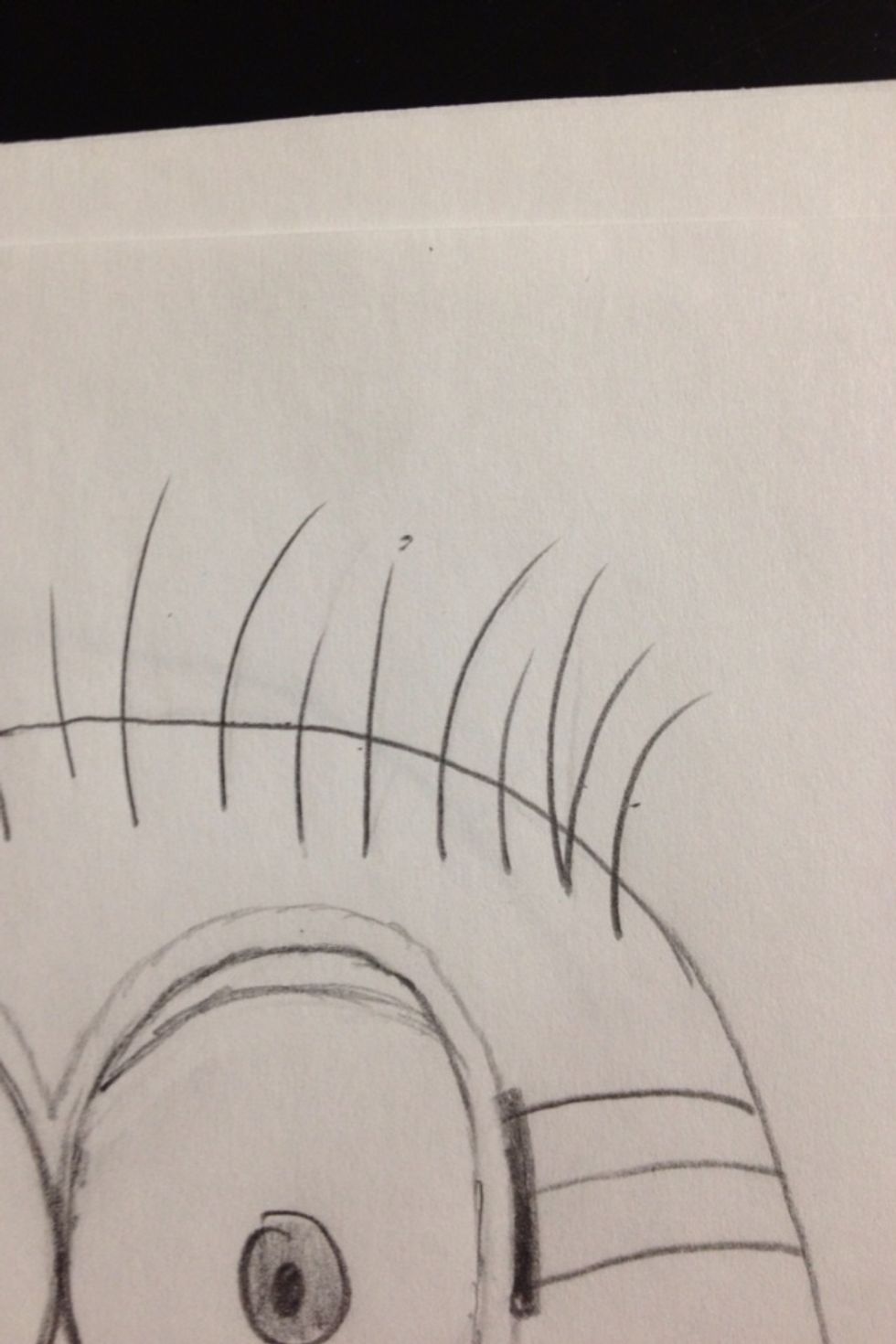 On the other side of his head do about 10 more strokes curling to the right