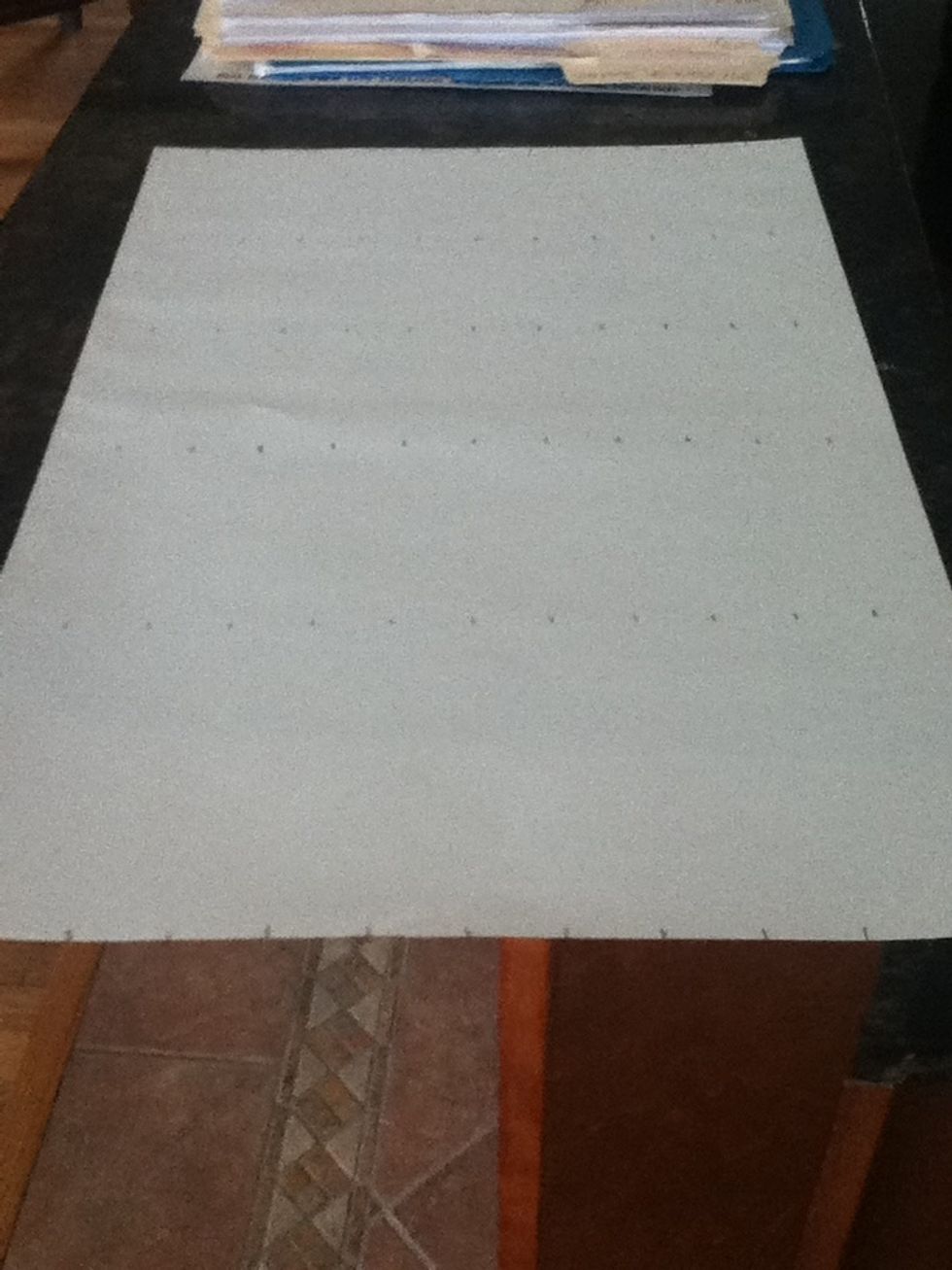 On the paper mark off every one inch. Make a couple of rows of marks