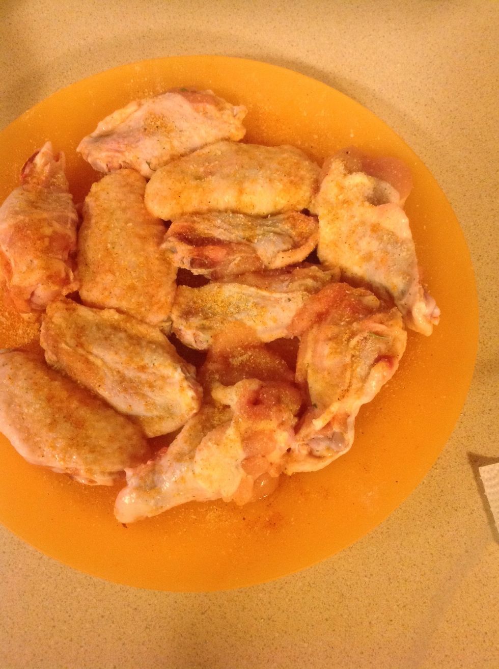 On the plate flatly lay the first batch of chicken and lightly season with seasoned salt and garlic salt (if using other seasons do the same) season chicken on both sides * REMEMBER VERY LIGHTLY*