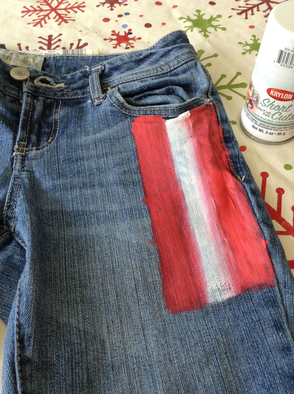 On the right side, paint alternating red and white stripes