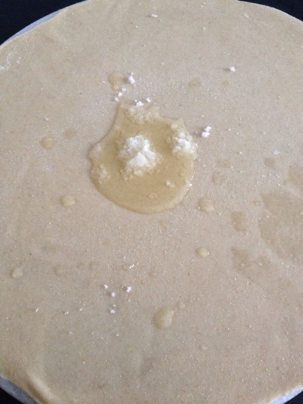 On the rolled dough add some oil and salt