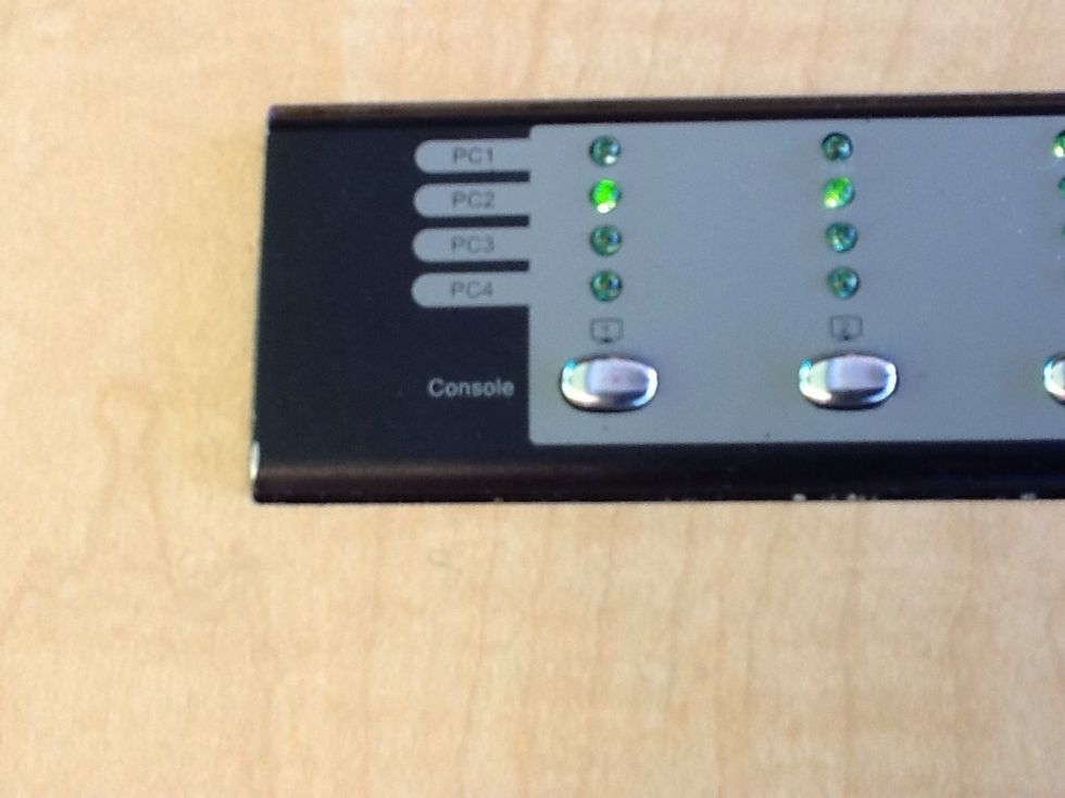 On the sandbox table use the control panel (4 buttons); press the button (only first 2 are required) until the PC light of the number the laptop is plugged into is selected.