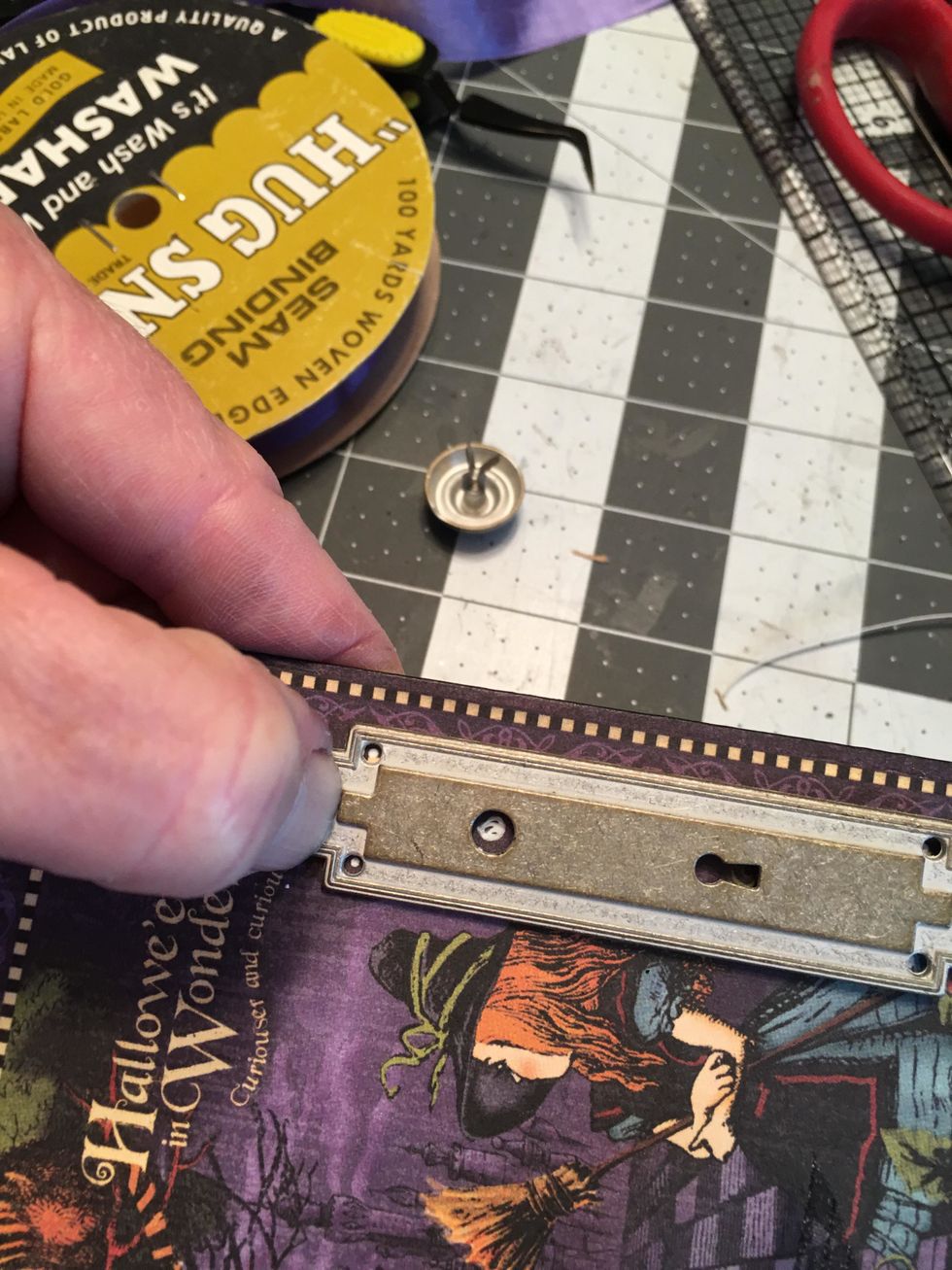 On the side, add a Graphic 45 Door plate and knob.  Fasten with the brads that come with the plate and knob.