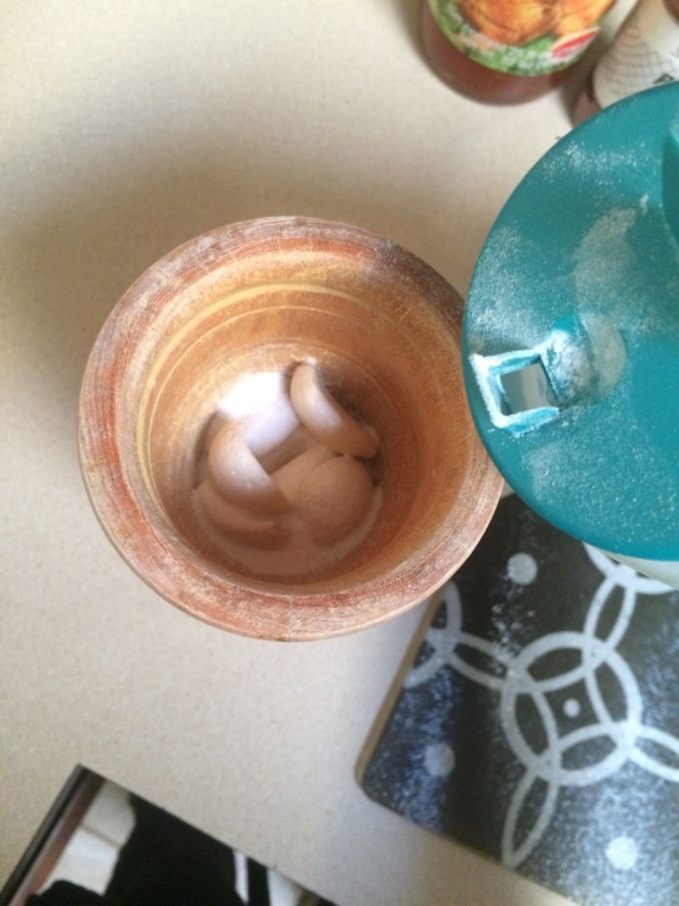 On the side you have to put garlic with salt so you can smash it up