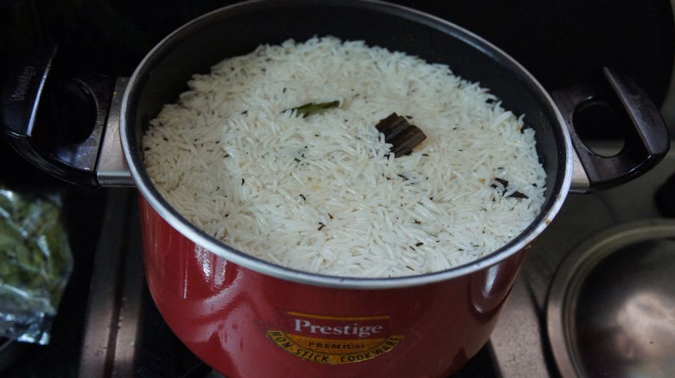 On top of fried onions add another layer of rice...