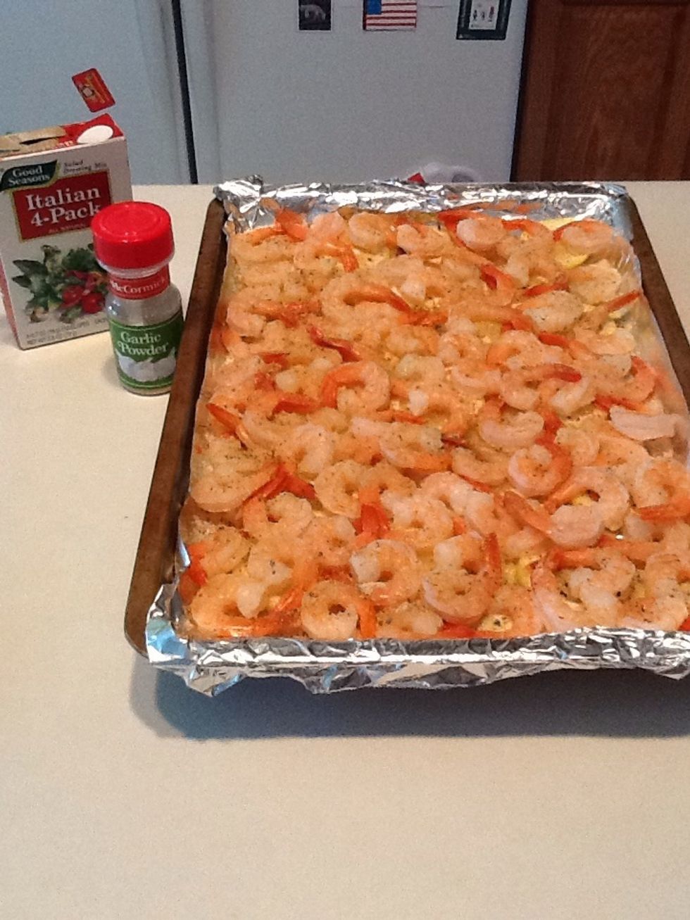On top of shrimp, sprinkle dry Italian dressing and a few sprinkles of garlic powder.  Place back in the oven and cook approximately 15 minutes.